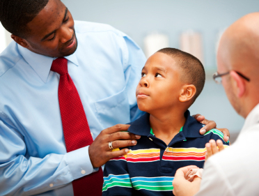 Doctor responding to a child and parent